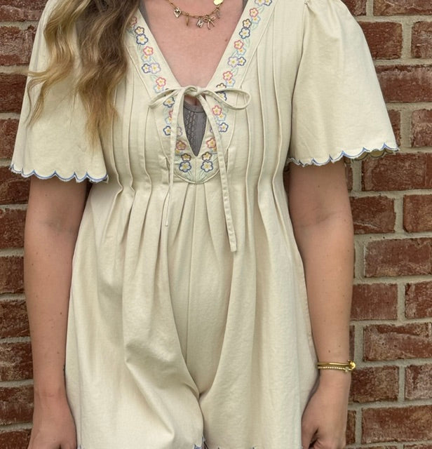Cream romper floral detail