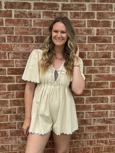 Cream romper floral detail